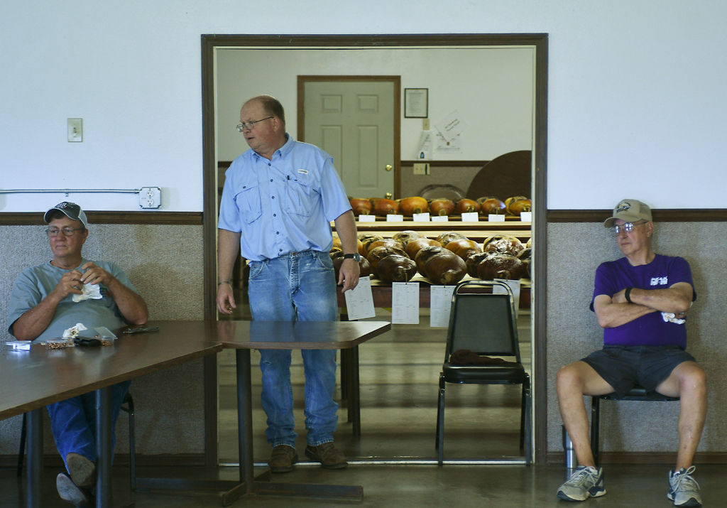 Stan Lynn, Jim Eschle and Ray George wait outside the judging room